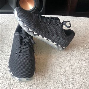 Blacks and white women’s Nobull shoes size 9